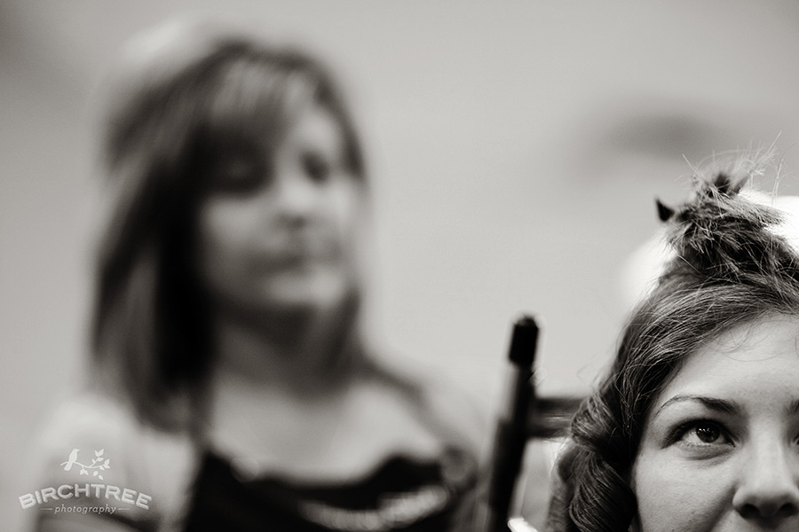 bride gets ready with curling iron