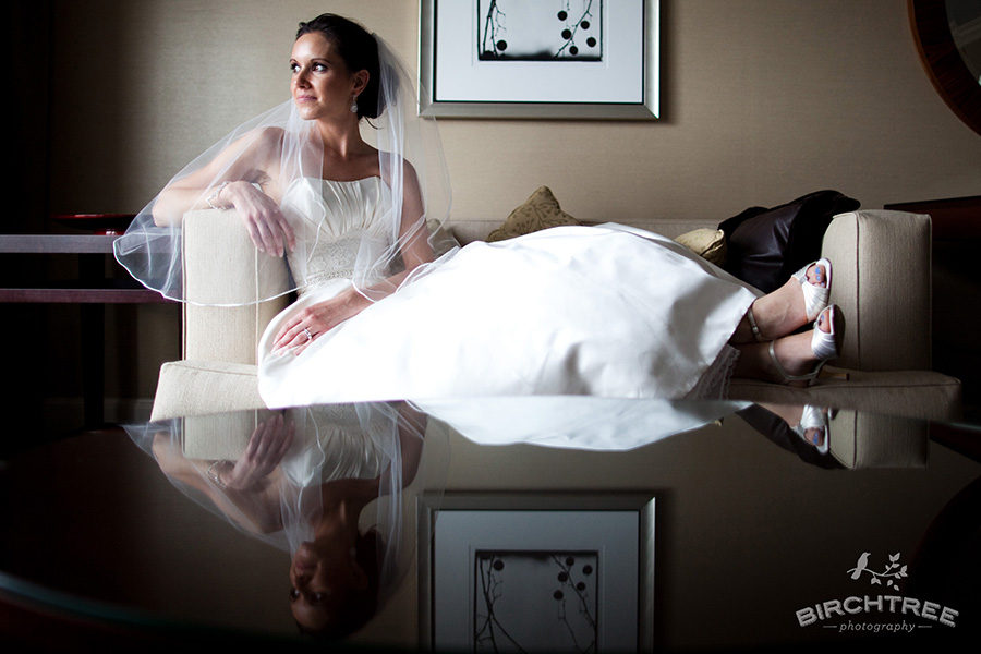 bride's reflection in table in hotel portrait